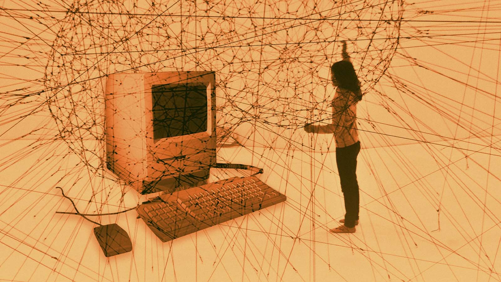 computador antigo sobre fundo representando uma teia de cálculos matemáticos