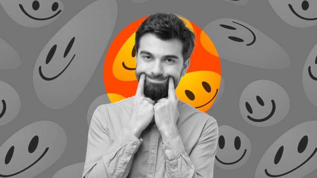 homem faz sorriso for&ccedil;ado com os dedos no rosto