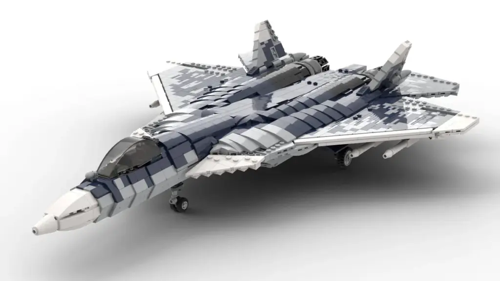 Modelo cinza de um ca&ccedil;a militar constru&iacute;do com blocos de montar.