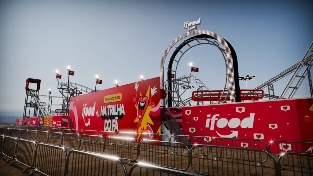 Montanha-russa do iFood instalada na Cidade do Rock, com estrutura e pain&eacute;is vermelhos da marca.