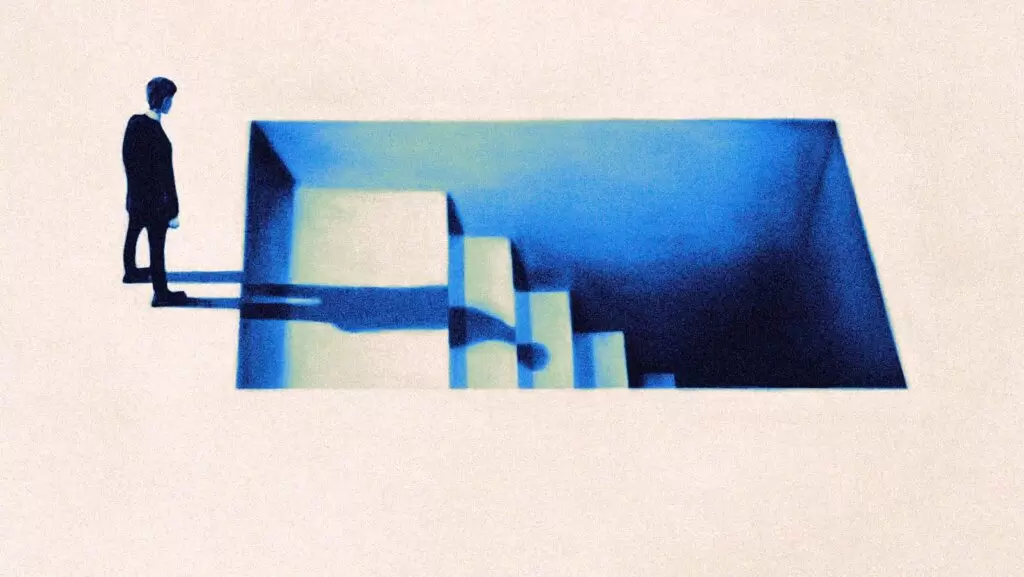 homem &agrave; beira de  escada que desce para o subsolo