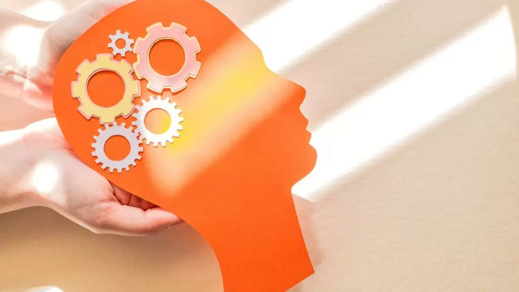 silhueta-da-cabeca-humana-com-figura-de-engrenagem-conceito-de-saude-mental-dia-mundial-da-saude-mental