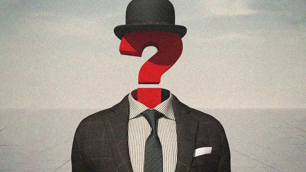 homem de chap&eacute;u com ponto de interroga&ccedil;&atilde;o no lugar da cabe&ccedil;a