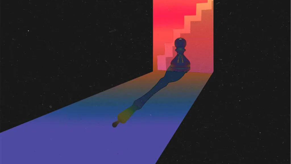 grande sombra de uma pessoa projetada na parede