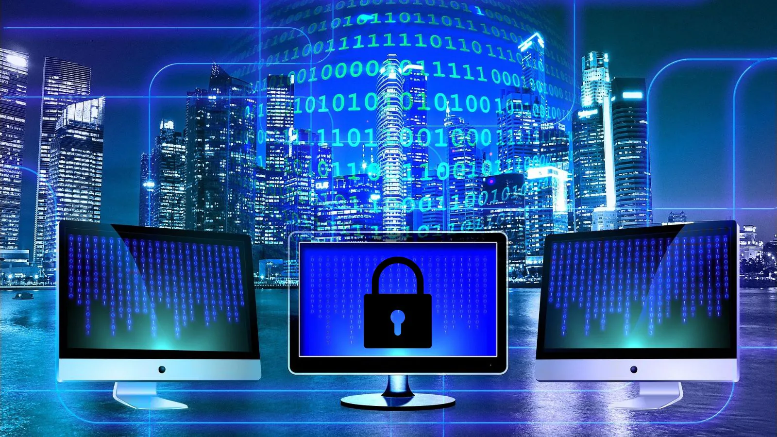 3 telas de computador e uma está com um cadeado